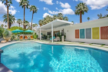 Sunny Palm Springs pool: chic, vibrant, inviting oasis