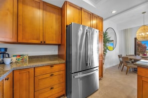 Plenty of cabinetry and modern appliances make island meals simple to prepare. KGV-24P7