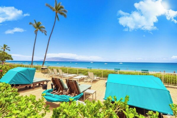 Private beach access with oceanfront loungers, luxury cabanas, panoramic ocean views, crystal waters & tropical resort gardens