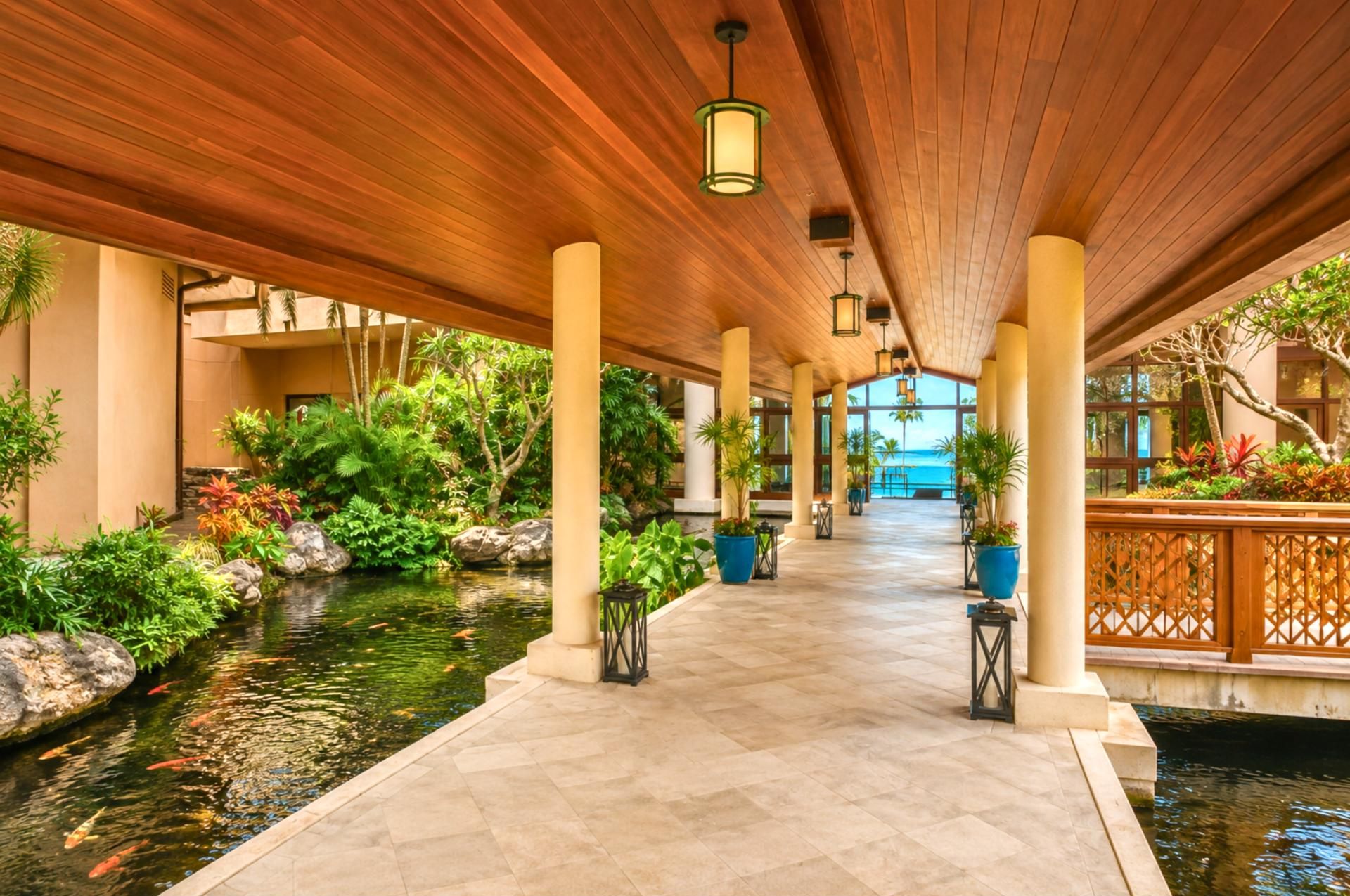 Enjoy shaded walkways surrounded by flowing ponds, exotic greenery & the soothing sounds of island serenity