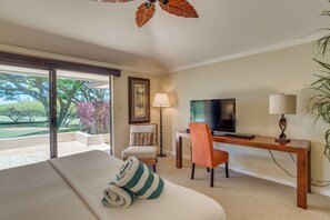 This inviting guest room brings joy with its pops of color, comfy chair, and a peek outside to lush, tree-lined serenity KGV-14P3