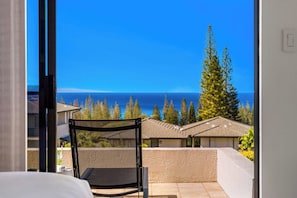A seating area just outside the primary bedroom captures relaxing ocean views. KGV-24P7
