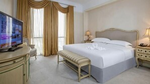 A hotel room with a bed, bedside tables, a TV, a bench, and curtains. - Jiaxing Haining Weijing Wyndham Hotel (Haining)