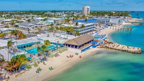 A coastal hotel with multiple buildings, a beach, and a pier. - Cabana Club, Kayaks, Pets, Boat Dock, Near Golf! (Key Colony Beach)