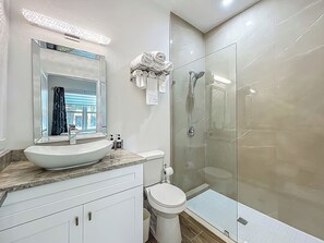 Shower, hair dryer, towels, soap