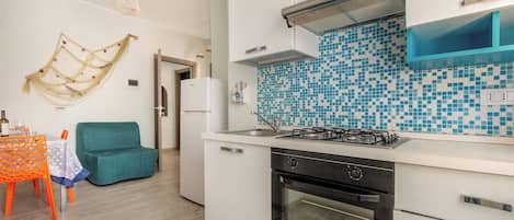 Fridge, microwave, stovetop, cookware/dishes/utensils