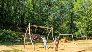 A playground with swings and a slide in a park. - RELAXING MOBILE HOME AND FRIENDLY POOL (Saint-Chéron)