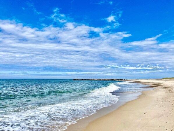 A beach with clear skies and calm waters.
