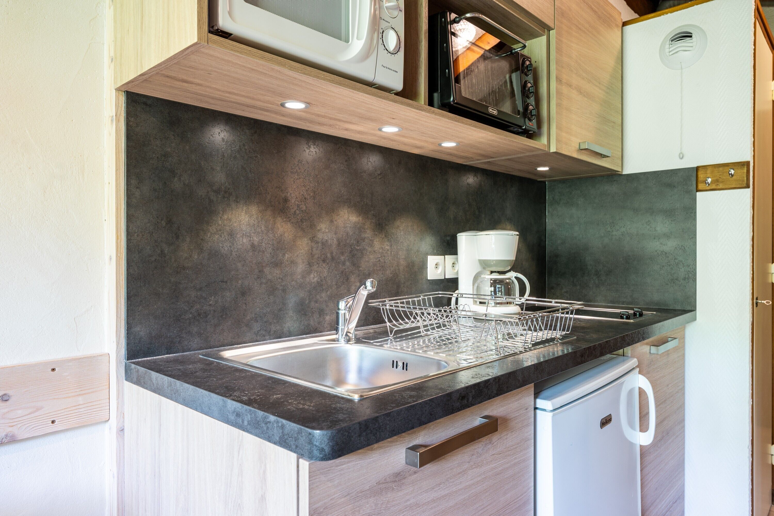 Fridge, microwave, stovetop, coffee/tea maker