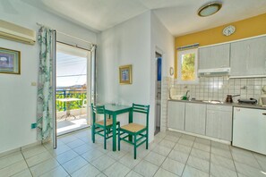 Fridge, stovetop, electric kettle, cookware/dishes/utensils