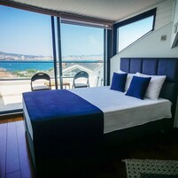 全景套房, 海景 | 免费迷你吧物品、客房内保险箱、笔记本电脑工作区、遮光窗帘