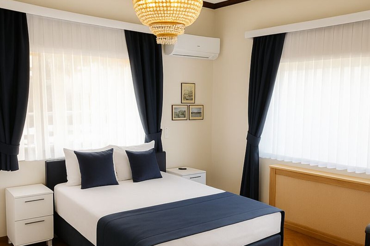 Superior Double Room, Courtyard View | Minibar (some free items), in-room safe, laptop workspace
