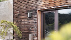 A wooden building with a sign that reads 'WESTROEN.' - Studio 'Röfen Mittelröfen' with Mountain View, Shared Terrace and Wi-Fi (Rovena)