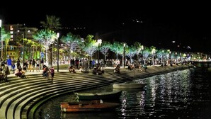 A waterfront promenade with steps leading down to the water, lined with trees and street lamps. - Spacious Sea View Apartment Private Balcony · Steps to Beach · Vlora Albania (Vlore)