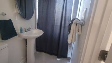 Shower, towels, soap, toilet paper