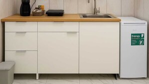 A compact kitchen with white cabinets, a wooden countertop, a sink, and a compact refrigerator. - Apartmentcomplete with kitchen and personal bathroom located downtown (Bari)