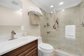 Shower, towels, soap, toilet paper