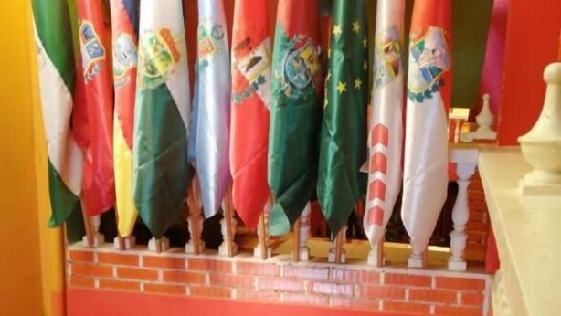 A row of flags on a balcony. - Olas del titicaca backpackers  (Copacabana)