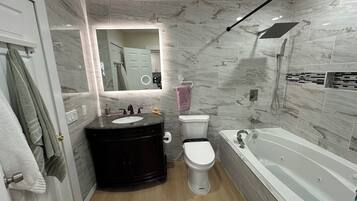 Shower, jetted tub, hair dryer, bidet