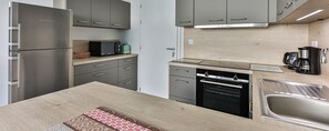 Fridge, microwave, stovetop, coffee/tea maker