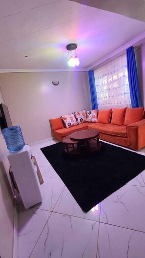 Apartment, City View | Living area | 32-inch plasma TV with digital channels - Lux Suites Elmoc Apartments Nakuru (Nakuru)