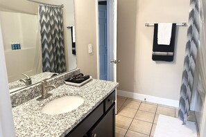 Hair dryer, towels, shampoo, toilet paper