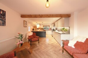 Téléviseur, livres, chaßne audio, bureau