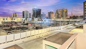 A construction site with multiple high-rise buildings under development, surrounded by a cityscape. - Stylish 4BR Family Villa – Easy Access to Dubai Marina & Expo City (Dubai)