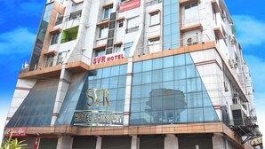 A multi-story hotel with a prominent 'SVR HOTEL & BANQUET' sign. - SVR HOTEL & BANQUET PATNA (Patna)