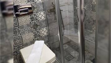 Shower, eco-friendly toiletries, hair dryer, slippers