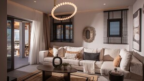 A modern living room with a sofa, coffee table, and decorative wall art.