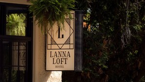 A hostel sign with the name 'Lanna Loft' and a geometric design. - Lanna Loft Hostel (Chiang Mai)