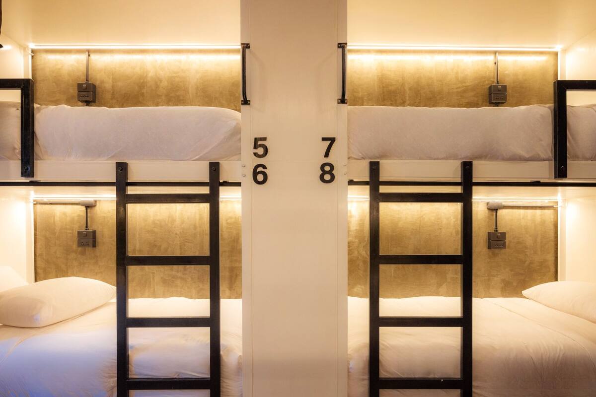 A bunk bed room with numbers 5, 6, 7, and 8 indicating the room numbers.