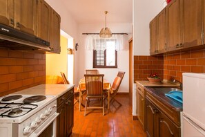 Apartment | Private kitchen | Fridge, oven, stovetop, electric kettle - Apartments Neve - Two-bedroom Apartment With Balcony and Sea View (Dubrovnik)