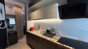 Fridge, microwave, stovetop, coffee/tea maker