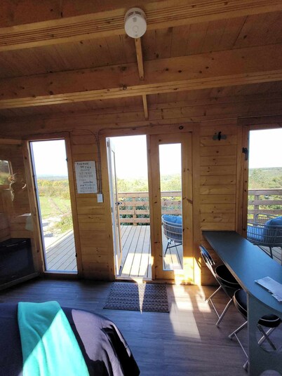 Bunkie with spectacular view, peaceful setting, and close to amenities.