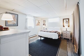 Desk, iron/ironing board, bed sheets