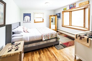 Desk, iron/ironing board, bed sheets