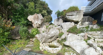 Private studio with your own waterfall garden and 5 minute walk to Hospital