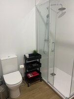 Standard Studio | Bathroom | Shower, hair dryer, towels, soap