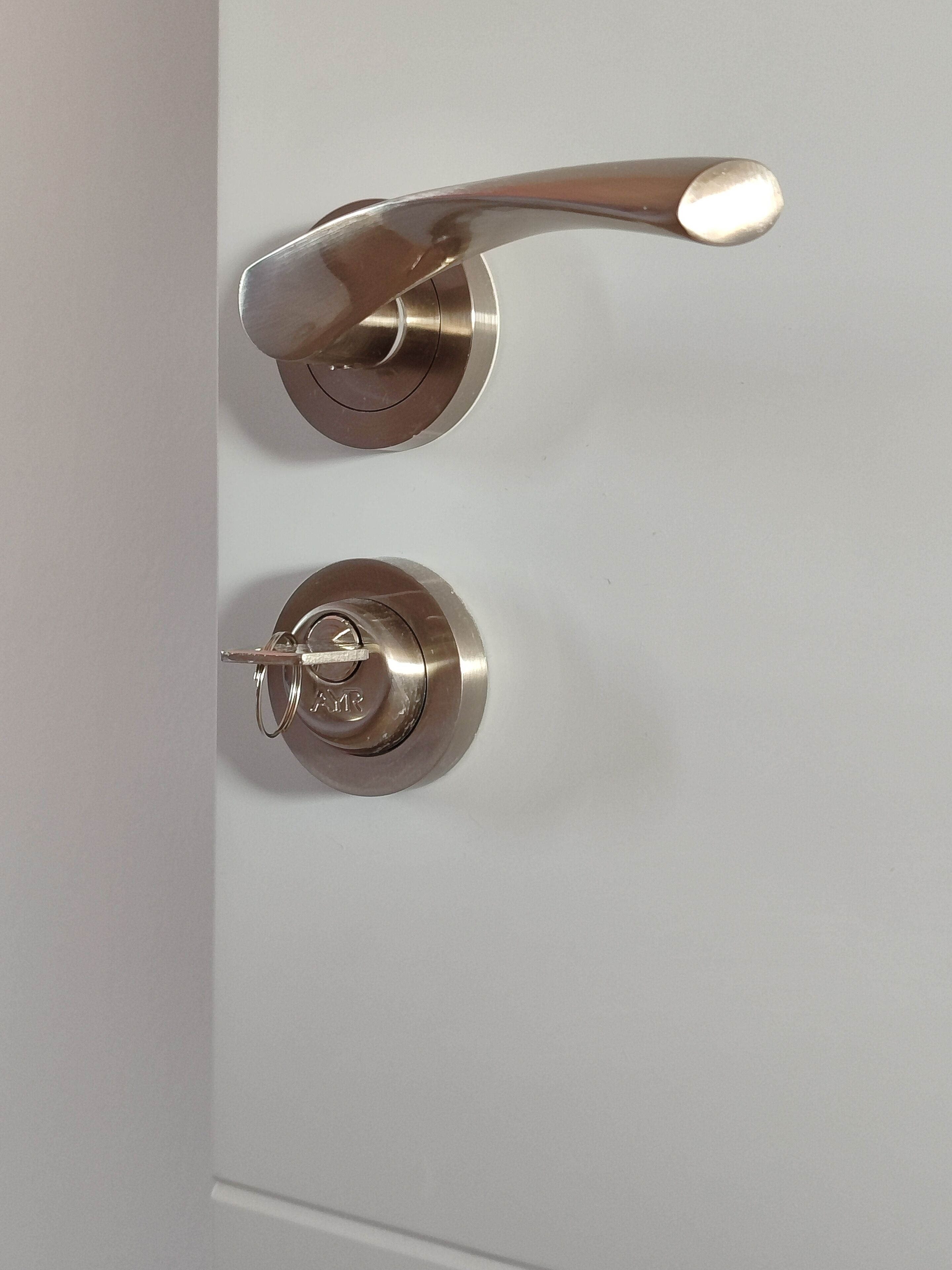 A modern door handle and lock mechanism.