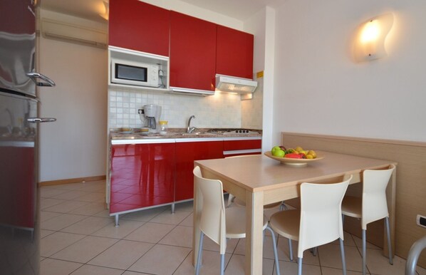 Fridge, stovetop, coffee/tea maker, cookware/dishes/utensils