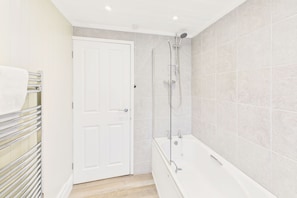 Shower, hair dryer, towels, shampoo