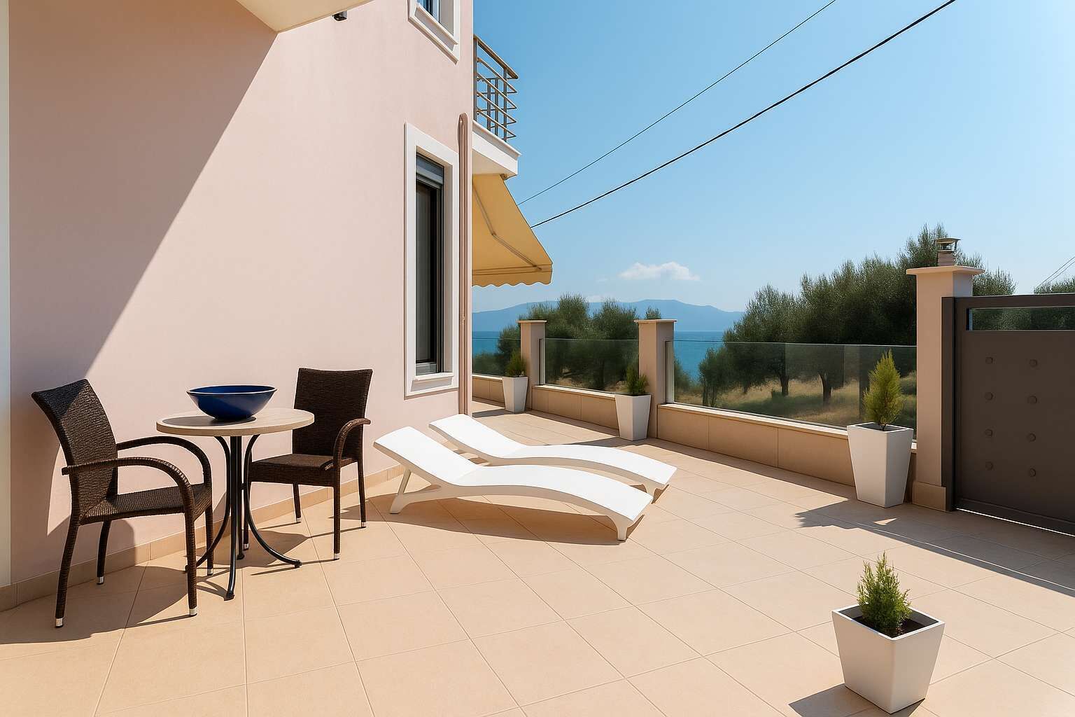 Spacious private courtyard with loungers and seating