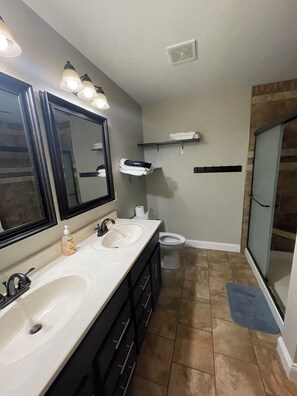 Shower, hair dryer, towels, soap