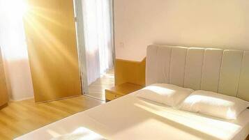 Family Room, Balcony, Sea View | Free minibar, laptop workspace