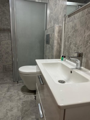 Family Room, Balcony, Sea View | Bathroom | Shower, soap, shampoo, toilet paper