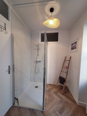 Shower, hair dryer, towels, soap