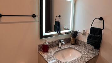 Hair dryer, towels, soap, shampoo