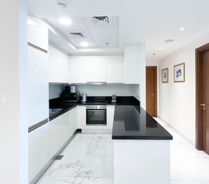 Microwave, stovetop, dishwasher, coffee/tea maker